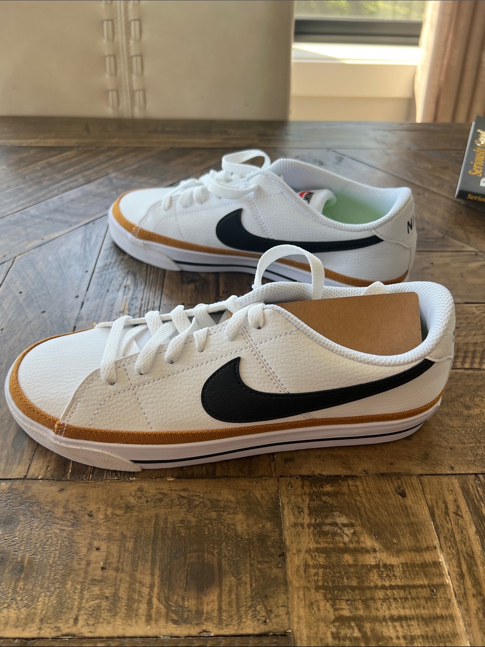 Nike Women’s White Sneakers with Black Swoosh and Tan Trim